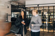 © Maskot - Smiling senior businesswoman talking with newly recruited female in office