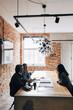 © Maskot - Male and female recruiter discussing with woman during job interview in office