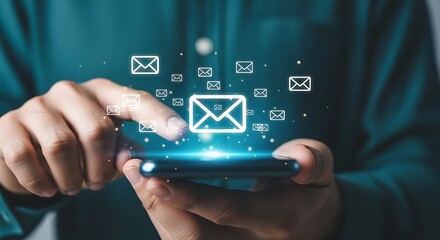 Person using smartphone with email icons and glowing effect message communication