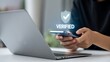 © SD AI - Woman verifies identity on smartphone with laptop for secure online access