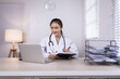 © SOMKID - Medical professional using a computer for online patient support, Medical professional and Healthcare technology Concept.