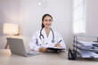 © SOMKID - Medical professional using a computer for online patient support, Medical professional and Healthcare technology Concept.