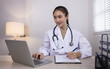 © SOMKID - Medical professional using a computer for online patient support, Medical professional and Healthcare technology Concept.