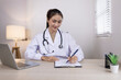 © SOMKID - Medical professional using a computer for online patient support, Medical professional and Healthcare technology Concept.