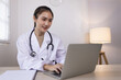 © SOMKID - Medical professional using a computer for online patient support, Medical professional and Healthcare technology Concept.