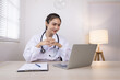 © SOMKID - Medical professional using a computer for online patient support, Medical professional and Healthcare technology Concept.