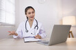 © SOMKID - Medical professional using a computer for online patient support, Medical professional and Healthcare technology Concept.