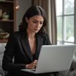 © AImageZ - Woman upset reading work email while sitting at home in formal attire