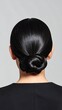 © sdfe - Sleek low bun hairstyle on straight, dark hair