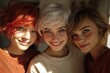 © Howl - Three young women with vibrant, expressive faces and varied hair colors, close-up portrait showcasing natural beauty and cheerful expressions.