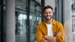 © Helga - Cheerful office employee in smart casual outfit, standing near glass wall in coworking space, arms crossed, positive workplace and career growth concept. cheerful office worker, co