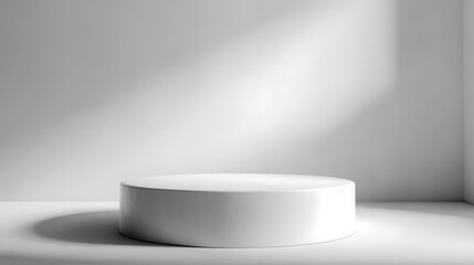 Wall Mural - An empty white cylindrical podium bathed in soft light casting subtle shadows on a minimalist studio background ideal for product display or branding
