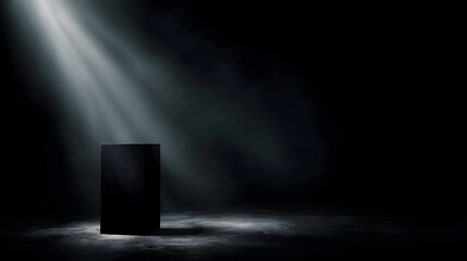 Wall Mural - A black pedestal is dramatically illuminated by a spotlight in a dark smoky studio