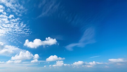 Wall Mural - a serene scene of clear blue skies with wispy white clouds peacefully drifting in the airy atmosphere creating a tranquil copy space image