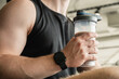 © svetlana_cherruty - Young bodybuilder and sporty man with protein shake while working out at gym or fitness center. Health care and workout.