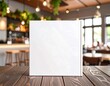 © Yuda - Blank white book on wooden table in cafe