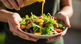 Fresh salad preparation with colorful vegetables and dressing pouring close up