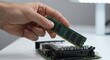 © Photyn Studio - Technician installing a modern RAM memory module into an open slot on a computer's motherboard.Concept of computer hardware and system upgrades.