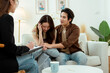 © tonefotografia - Couple in Counseling Session Discussing Relationship Issues With Therapist in Bright Office