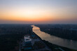 Suizhou City China river landscape at sunset with city buildings stretching along the water.