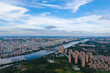 Suizhou city skyline stretches wide beside river showing many buildings under blue sky.