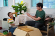 © itchaznong - Couple Enjoying Moment While Unpacking New Home