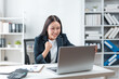 © amnaj - Businesswoman celebrating success looking at laptop screen