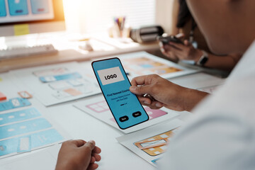 Person holding mobile phone mockup designing UI UX