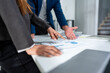 © Kawee - Close up hands of businessman and businesswoman brainstorm in office.