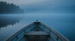 © kalijali - Wooden boat on calm water with a forest background at dawn or dusk atmospheric nature scenery