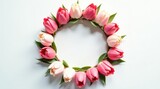 A delicate wreath of pink and white tulips arranged in a circular frame, perfect for spring celebrations or romantic events.