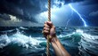 © Benxiumo - A powerful hand grips a thick rope amidst a raging ocean storm with lightning striking the stormy sky