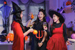 © crizzystudio - Young asian women celebrating halloween party together