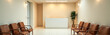 © fotoluigi868 - sterile waiting room walls minimalist reception desk rows worn leather chairs soft overhead