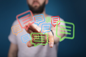 Concept of communication on the Internet. Man interacts with speech bubble icons. Online social network and connection.
