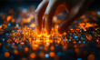 © Bartek - Human hand interacting with glowing digital circuit board technology interface with orange and blue light elements closeup macro view