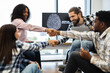 © sofiko14 - Young professionals collaboratively engage in work on artificial intelligence, promoting teamwork and innovation. Strong emphasis on diversity, cooperation, and successful project completion