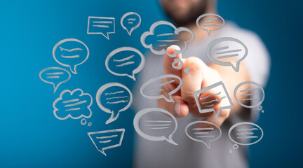 Conceptual image of a man using digital speech bubbles. Represents communication, technology and social media interaction within a network.