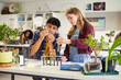 © Rido - Science students examines biology experiment at school