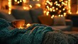© Nusrat - Cozy scene of knitting in progress on a couch with warm lighting