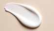© papa - Smooth, creamy white lotion smear on a light beige background