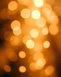 © Oak - An abstract background of warm, golden, out-of-focus bokeh lights, creating a magical, festive, and celebratory mood