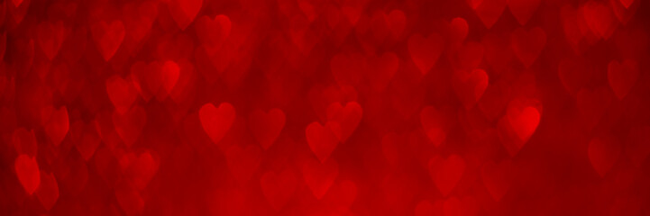 Wall Mural - Red hearts, sparkling glitter bokeh background banner, valentines day abstract defocused texture header.
