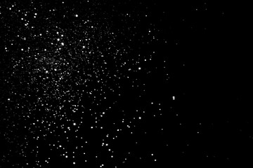 Wall Mural - White gray blurred bokeh lights on black background. Glitter sparkle stars for celebrate. Overlay for your design