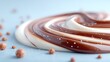 © santi - Close Up of Swirled Chocolate and Cream with Scattered Candy Spheres on Light Blue Surface High Resolution Macro Display