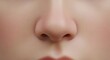 © visualdalamframe - Close-up of a human nose with subtle skin texture and detail, showing nostrils