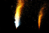 Two bright fireworks exploding with sparks and light