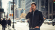 © Felippe Lopes - A concerned man talks on his cell phone while standing in the sunlit bustling city exuding focus and urban style