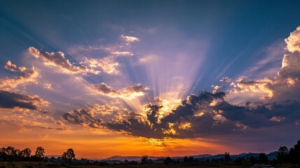 Wall Mural - Breathtaking Sunset with Colorful Clouds and Radiant Sunbeams