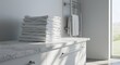© Fasbir - Tall Stack of Fresh White Towels on a Marble Countertop